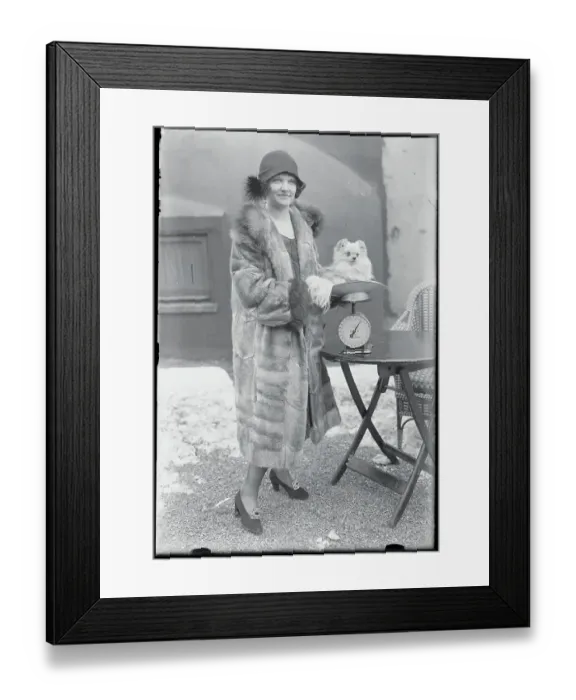 Framed Print : Woman Weighing Her Dog Framed Print : Woman Weighing Her Dog