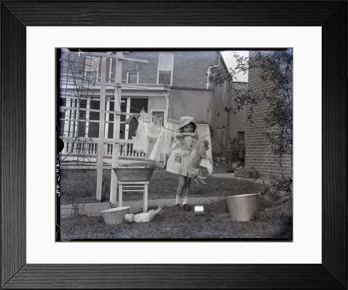 Framed Print : Hanging Puppy to Dry with Clothes Framed Print : Hanging Puppy to Dry with Clothes