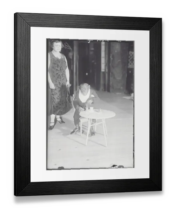 Framed Print : Woman Nearby Young Gorilla at Table Framed Print : Woman Nearby Young Gorilla at Table