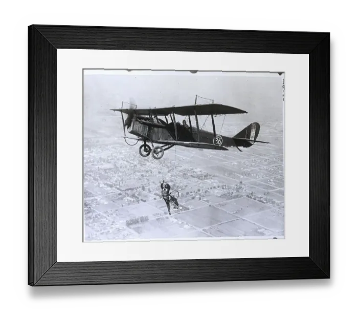 Framed Print : Man On Bicycle Falling From Plane Framed Print : Man On Bicycle Falling From Plane