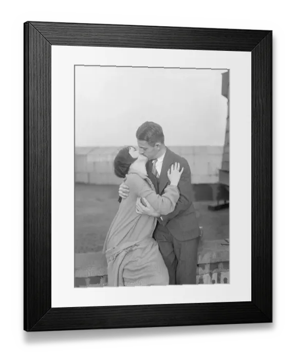 Framed Print : Vintage photograph showing couple engaged in kiss Framed Print : Vintage photograph showing couple engaged in kiss