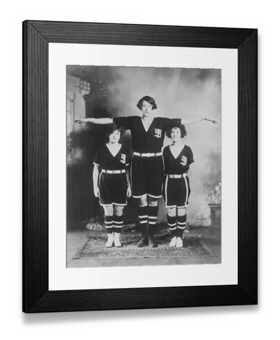 Framed Print : Very Tall Female Basketball Star Posing with Her Peers Framed Print : Very Tall Female Basketball Star Posing with Her Peers