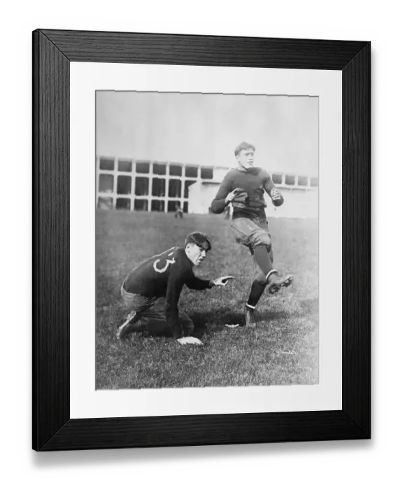 Framed Print : Football Players Practicing Place Kicking Framed Print : Football Players Practicing Place Kicking