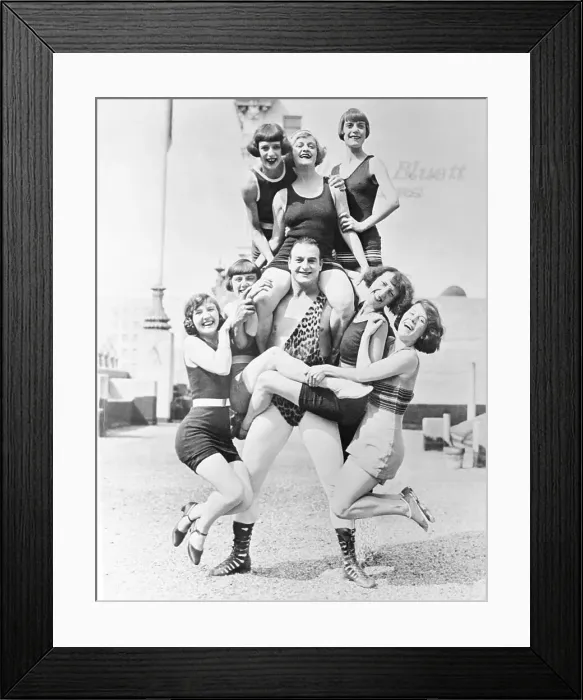 Framed Print : Man Posing with Several Women Framed Print : Man Posing with Several Women