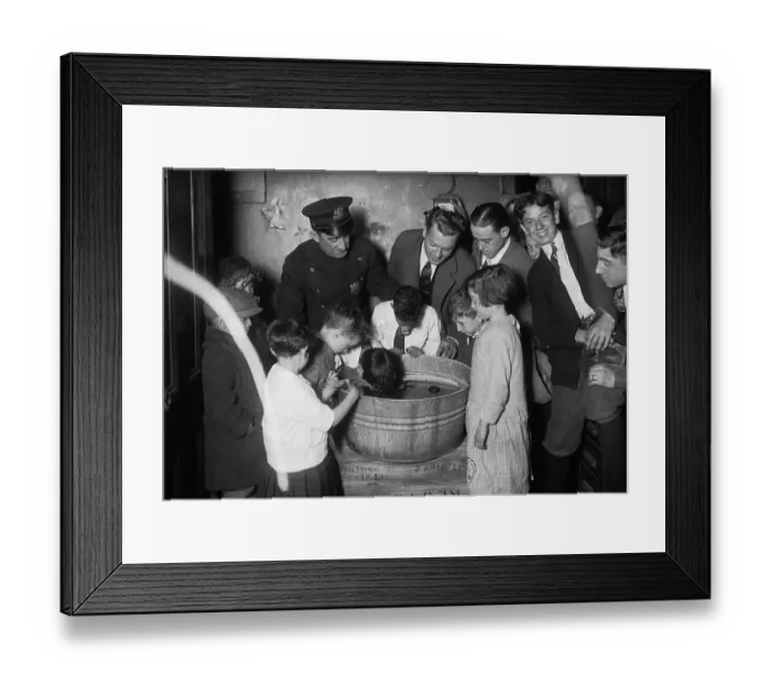 Framed Print : Boys (7-8 years) taking part in apple competition. October 25, 1925 Framed Print : Boys (7-8 years) taking part in apple competition. October 25, 1925