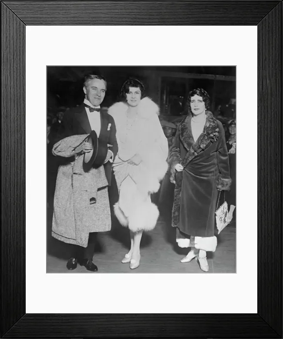 Framed Print : Charlie Chaplin Posing with His Wife and a Friend Framed Print : Charlie Chaplin Posing with His Wife and a Friend