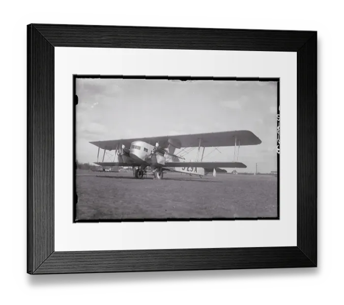 Framed Print : Sikorsky Commercial Airplane Parked in a Field