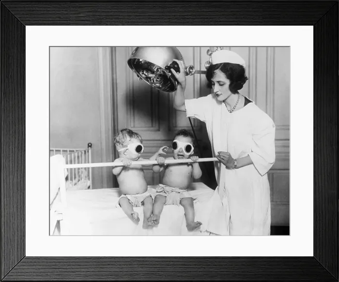 Framed Print : Babies Sunning with Artificial Lamps Framed Print : Babies Sunning with Artificial Lamps