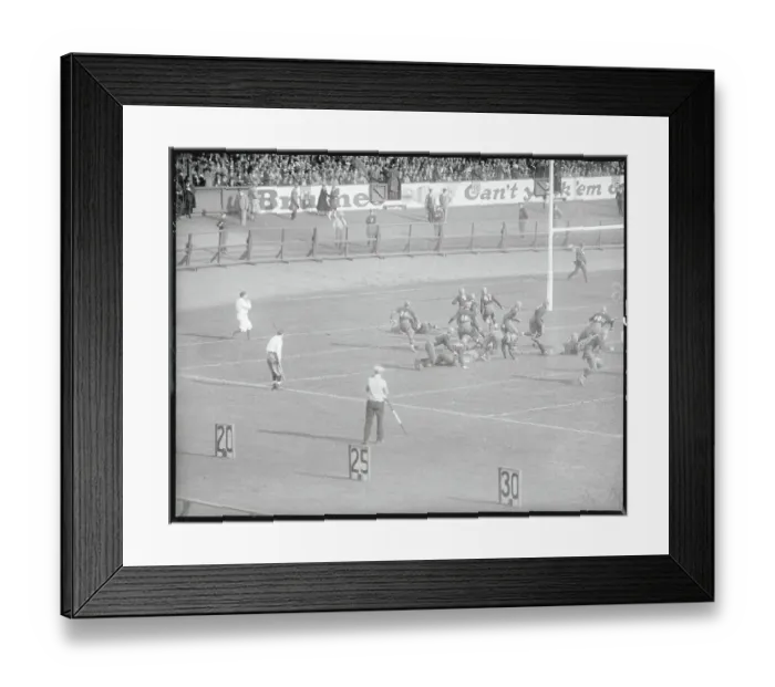Framed Print : Football Players Competing in a Game Framed Print : Football Players Competing in a Game