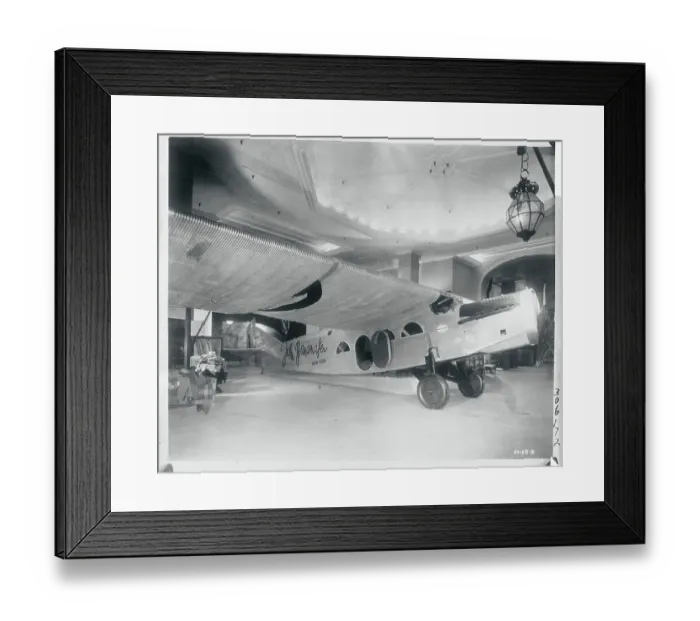 Framed Print : Store Displaying Plane for Sale