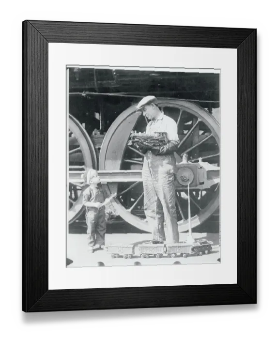 Framed Print : Locomotive Engineer Holding Model Train Framed Print : Locomotive Engineer Holding Model Train