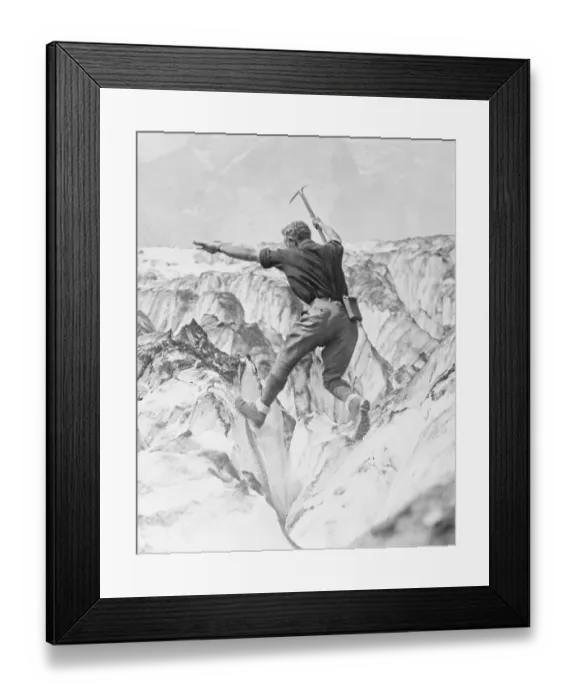 Framed Print : Man Jumping Across Glacier Crevasse Framed Print : Man Jumping Across Glacier Crevasse