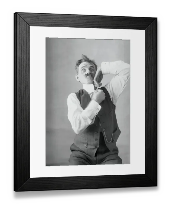 Framed Print : Middle-aged man adjusting collar. August 11, 1925