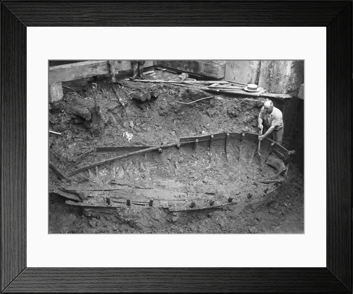 Framed Print : Archaeologist Digging Around Boat Framed Print : Archaeologist Digging Around Boat