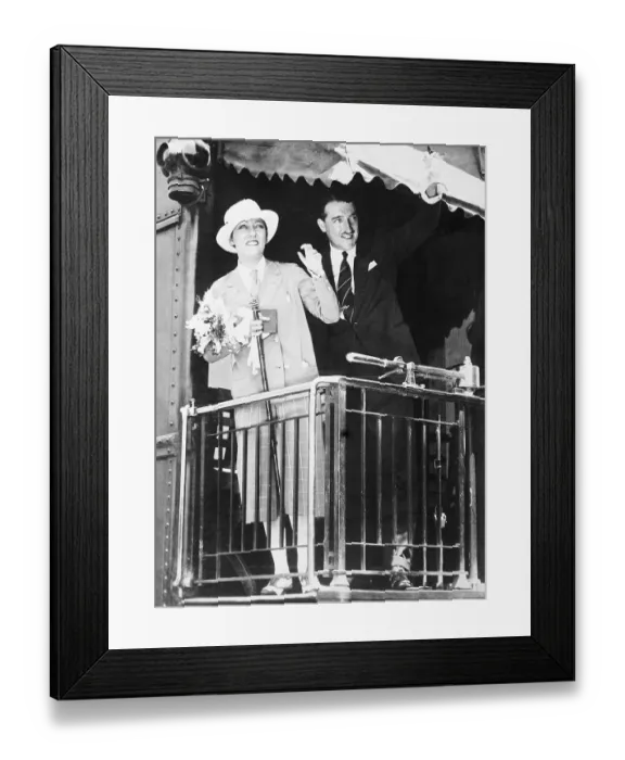 Framed Print : Gloria Swanson and Her Husband Waving Framed Print : Gloria Swanson and Her Husband Waving