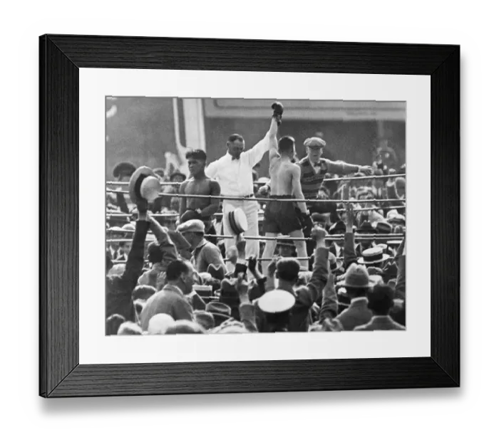 Framed Print : Referee Holds Boxer'S Hand In Victory Framed Print : Referee Holds Boxer'S Hand In Victory