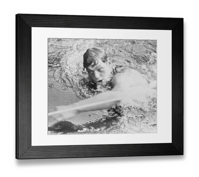 Framed Print : Johnny Weismuller Winning Swim Race