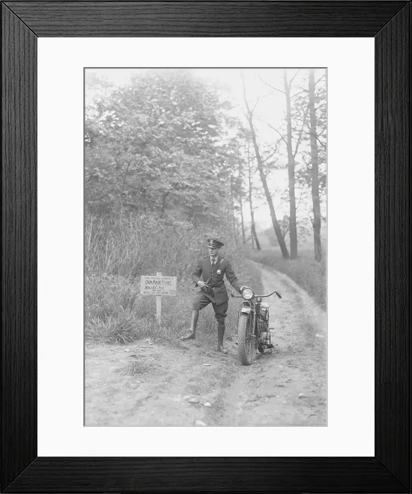 Framed Print : Policeman Pausing by His Motorcycle at Posted Sign Framed Print : Policeman Pausing by His Motorcycle at Posted Sign