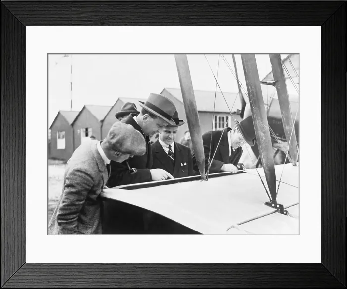 Framed Print : Men Examining Early Aircraft