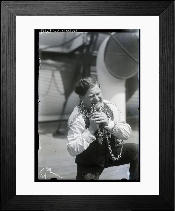 Framed Print : Man Demonstrates Teeth Chain Breaking Framed Print : Man Demonstrates Teeth Chain Breaking