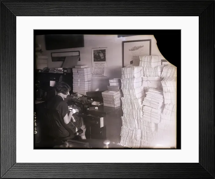 Framed Print : Stenographer Working at Cluttered Desk