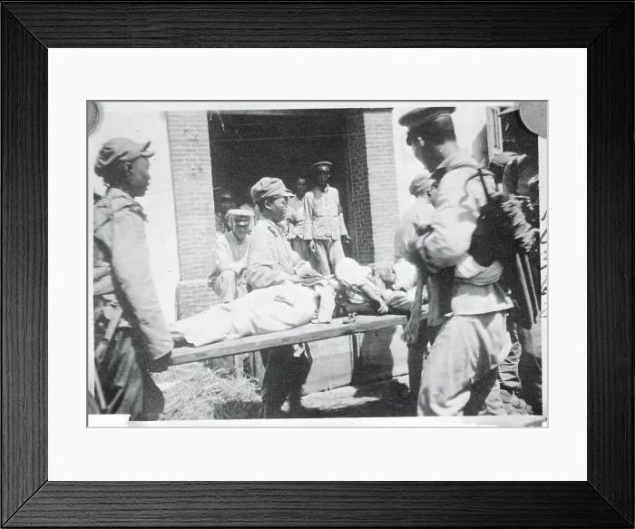 Framed Print : Men Carrying a Wounded Soldier on a Stretcher