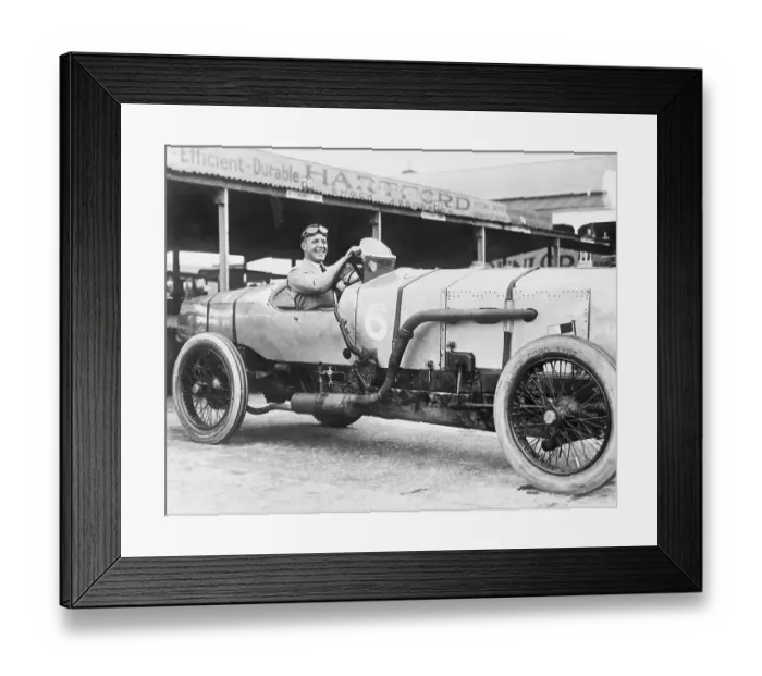 Framed Print : Auto Racer Posing in His Car