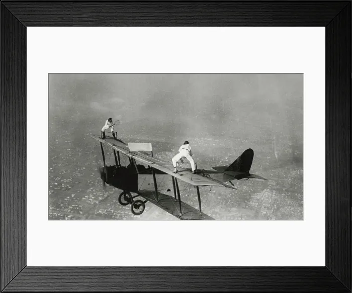 Framed Print : Stunt Flyers Performing on Wings of Airplane Framed Print : Stunt Flyers Performing on Wings of Airplane