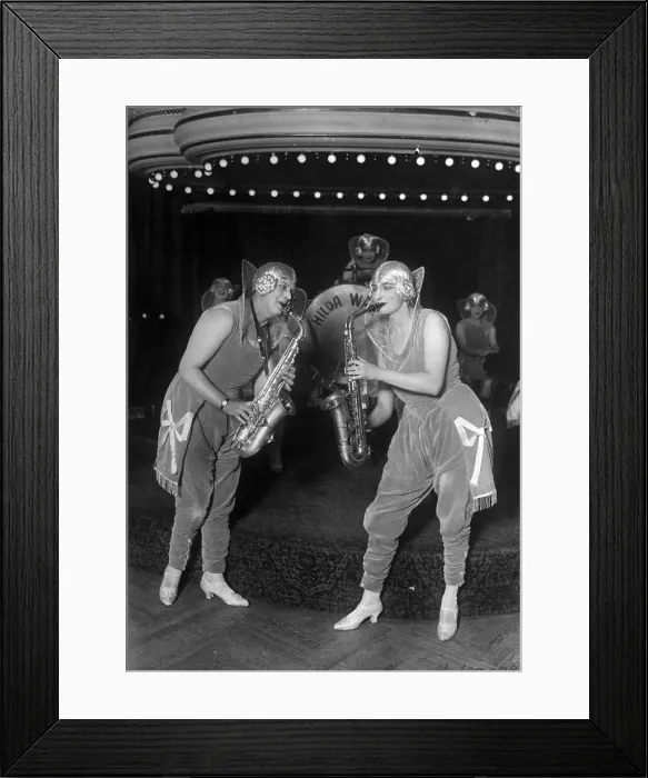 Framed Print : Young Women Playing Saxophones Framed Print : Young Women Playing Saxophones