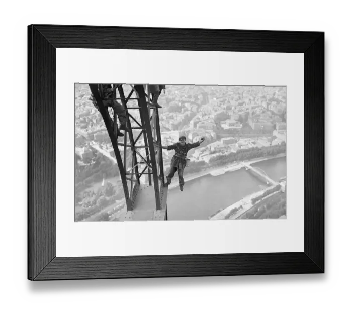 Framed Print : Eiffel Tower Painter Makes Risky Pose Framed Print : Eiffel Tower Painter Makes Risky Pose