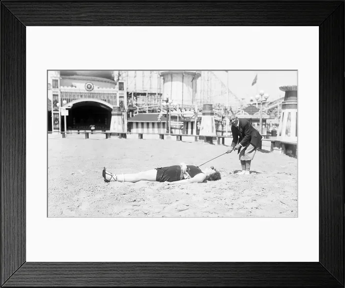Framed Print : Man Teeing Off from Nose of Woman Framed Print : Man Teeing Off from Nose of Woman
