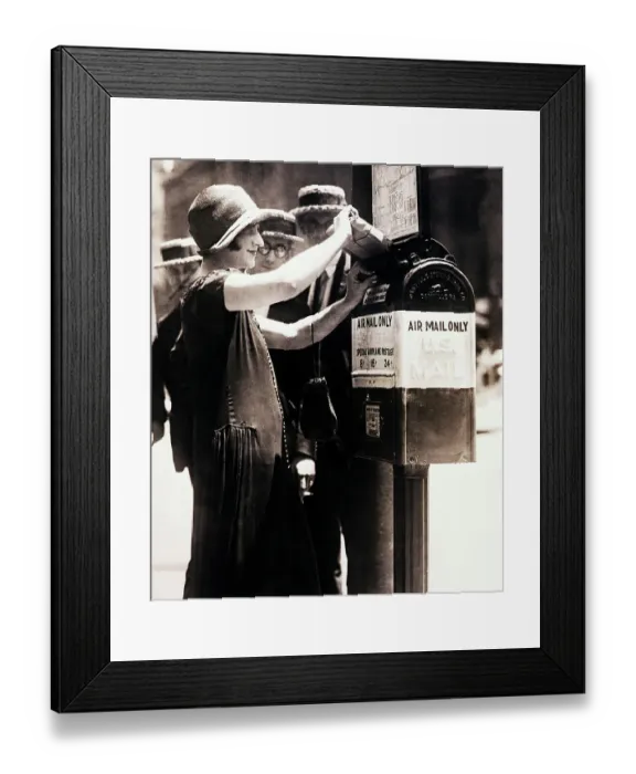 Framed Print : Woman Putting Package into First Airmail Framed Print : Woman Putting Package into First Airmail