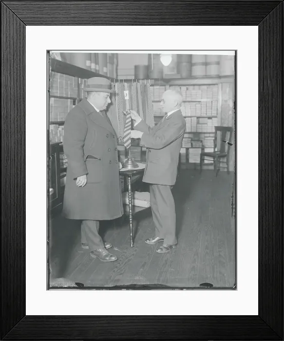 Framed Print : Henry Siegel Choosing a Necktie for Customer Framed Print : Henry Siegel Choosing a Necktie for Customer