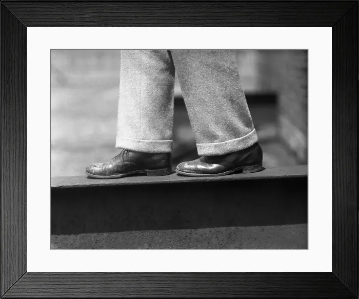Framed Print : Close up of mens legs on ledge Framed Print : Close up of mens legs on ledge