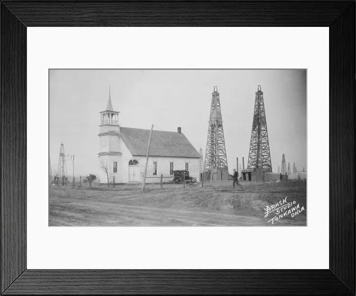 Framed Print : Oil Well Construction Behind Church Framed Print : Oil Well Construction Behind Church
