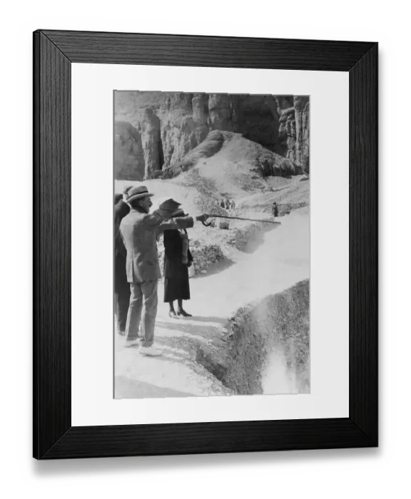 Framed Print : Howard Carter Pointing to Egyptian Tomb Area