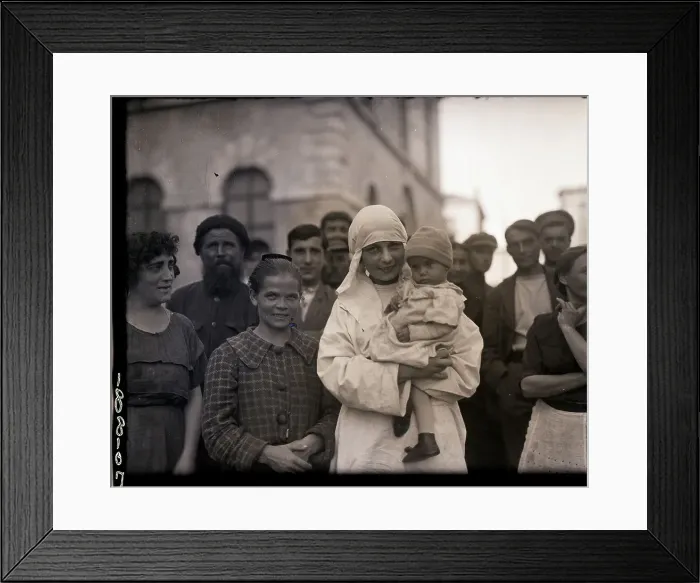 Framed Print : Russian Nurse Smiles As She Holds Child Framed Print : Russian Nurse Smiles As She Holds Child
