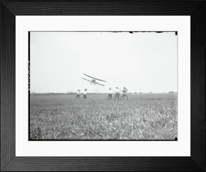 Framed Print : Men Filming Airplane in Flight Framed Print : Men Filming Airplane in Flight
