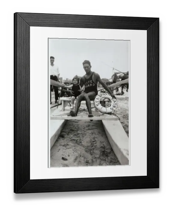 Framed Print : Life Guard Posing with Infant Framed Print : Life Guard Posing with Infant