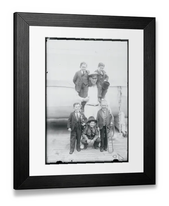 Framed Print : Man with Group of Little People