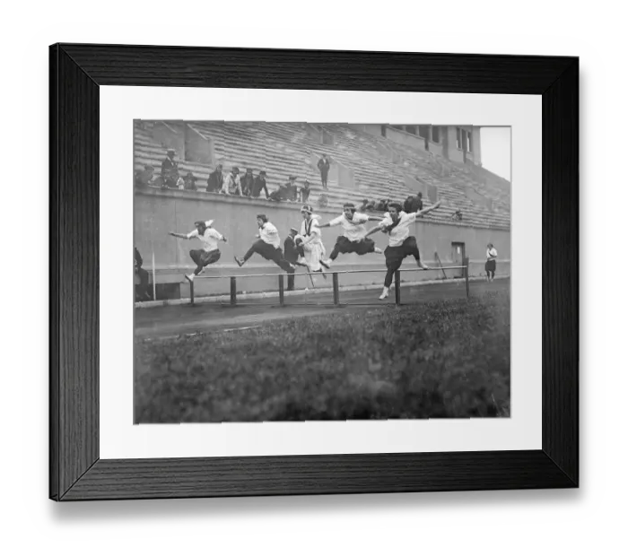 Framed Print : Athletes Jumping over Hurdles Framed Print : Athletes Jumping over Hurdles