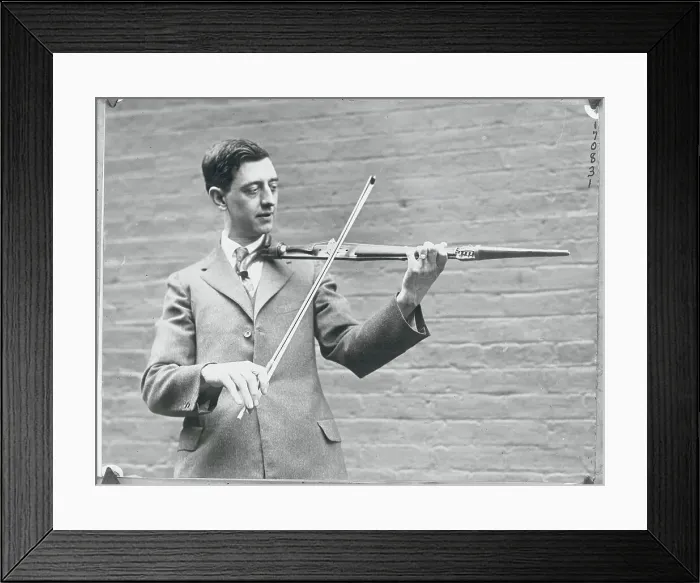 Framed Print : Man Playing Unique Instrument Framed Print : Man Playing Unique Instrument