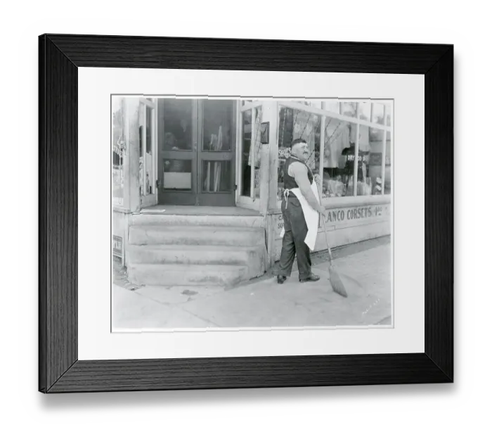 Framed Print : Store Owner Sweeping Sidewalk Framed Print : Store Owner Sweeping Sidewalk