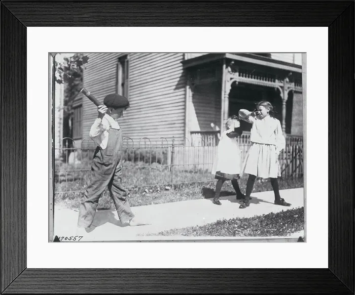 Framed Print : Boy Throwing Firecracker at Playmates Framed Print : Boy Throwing Firecracker at Playmates