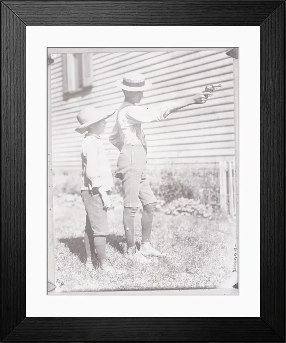 Framed Print : Boy Aiming a Revolver Framed Print : Boy Aiming a Revolver