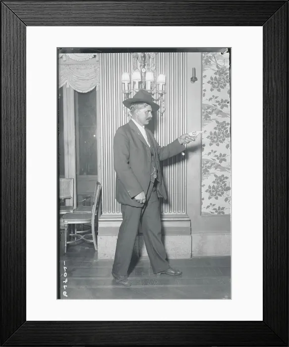 Framed Print : Man Aiming Gun in Parlor Framed Print : Man Aiming Gun in Parlor
