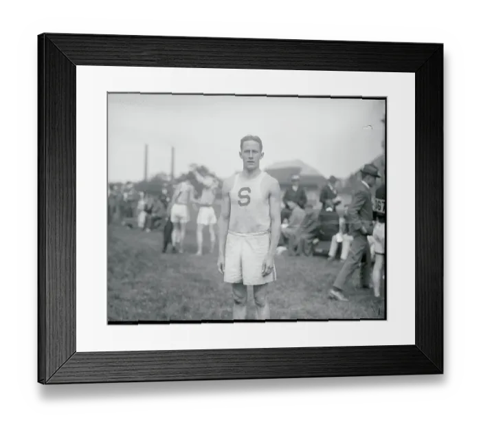 Framed Print : One Mile Run Winner at Track and Field Meet Framed Print : One Mile Run Winner at Track and Field Meet