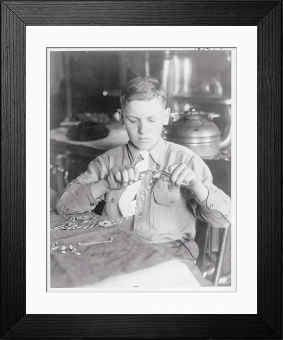 Framed Print : Boy Making Novelty Chains Framed Print : Boy Making Novelty Chains