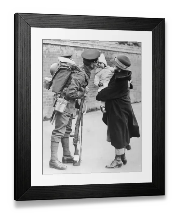 Framed Print : Soldier Kissing a Baby Framed Print : Soldier Kissing a Baby