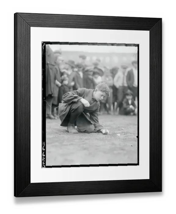 Framed Print : Boy Shooting Marbles Framed Print : Boy Shooting Marbles